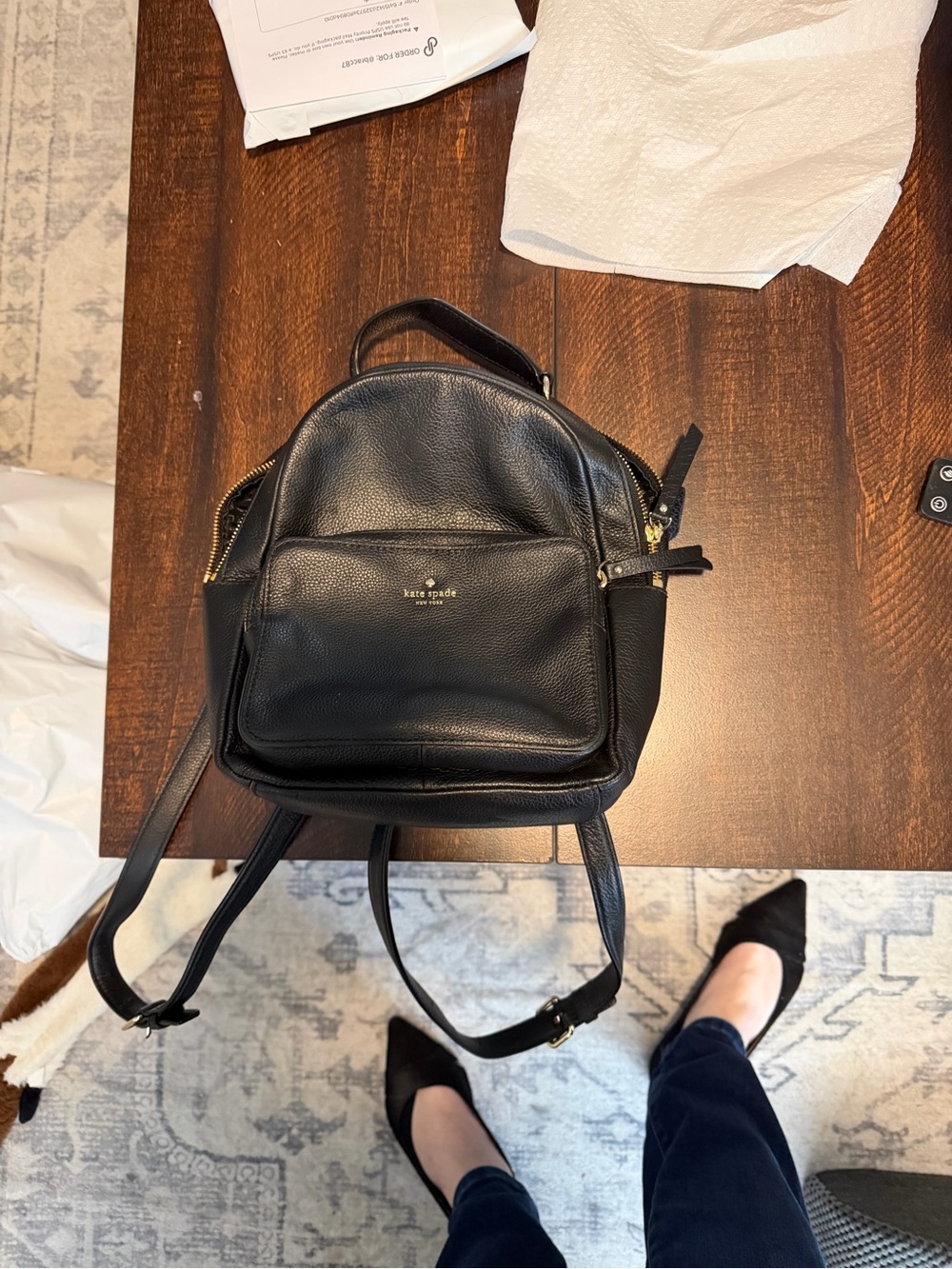 kate spade black logo-lined handbag interior with gold foil badge